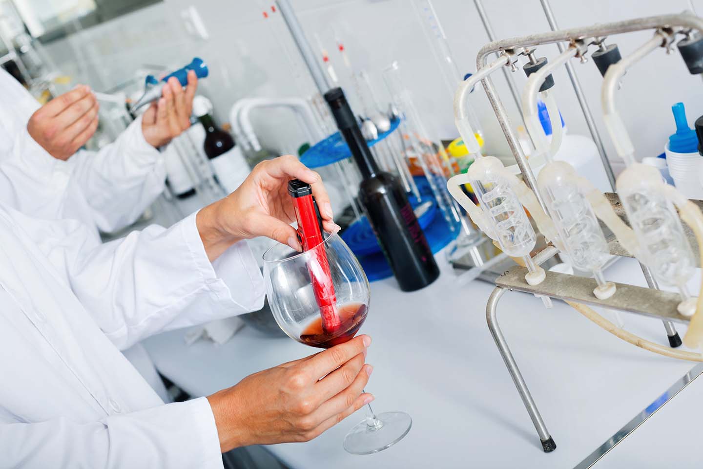 chemical testing wine products in professional laboratory environment