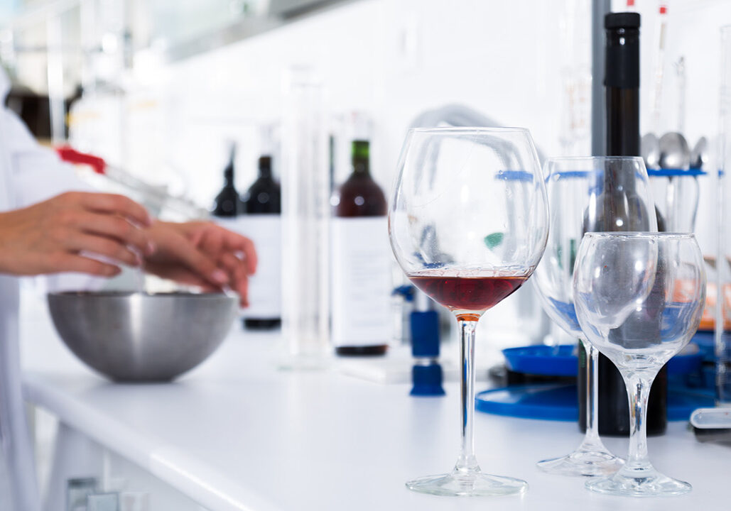 Glass of wine in laboratory being tested for glyphosate